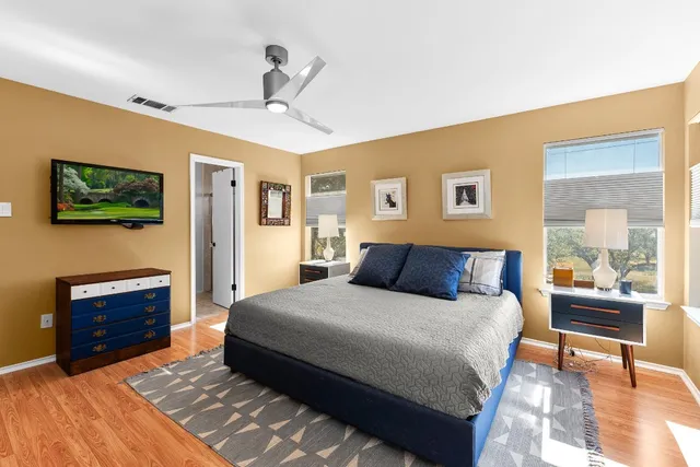 a bedroom with a bed and a dresser