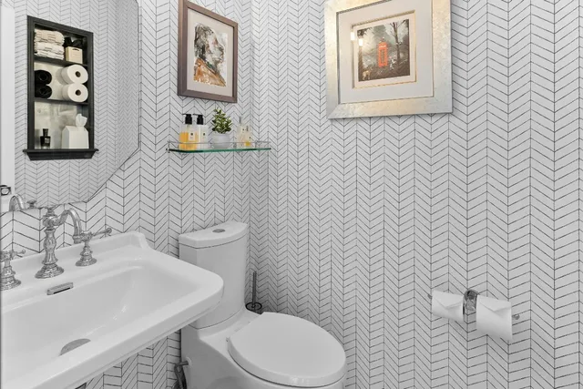 a bathroom with a toilet and a sink