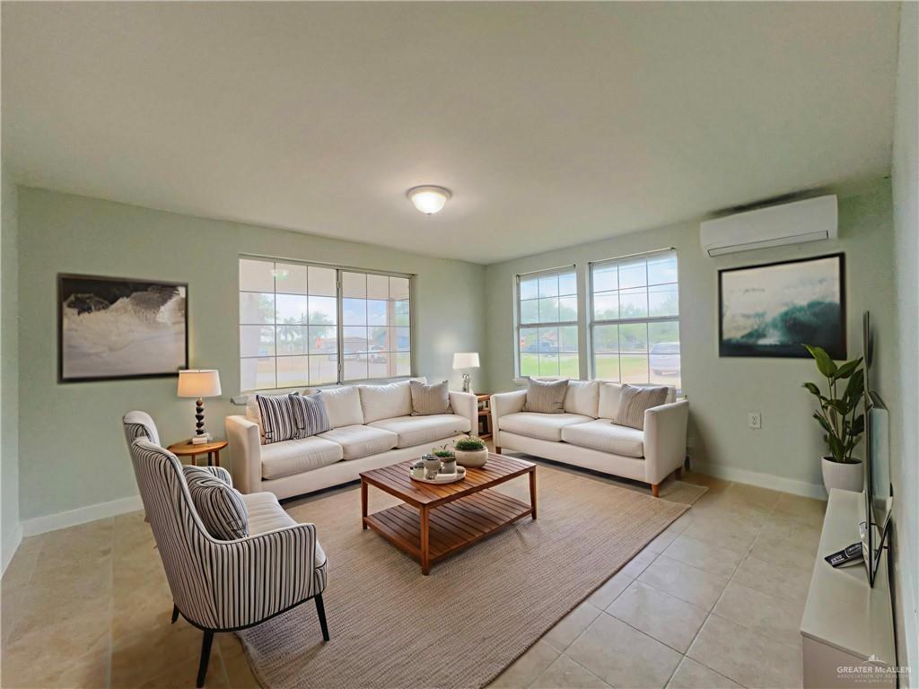 302 La Jara Avenue Santa Rosa, TX 78593 - Photo 6 of 13 a living room with furniture and a large window