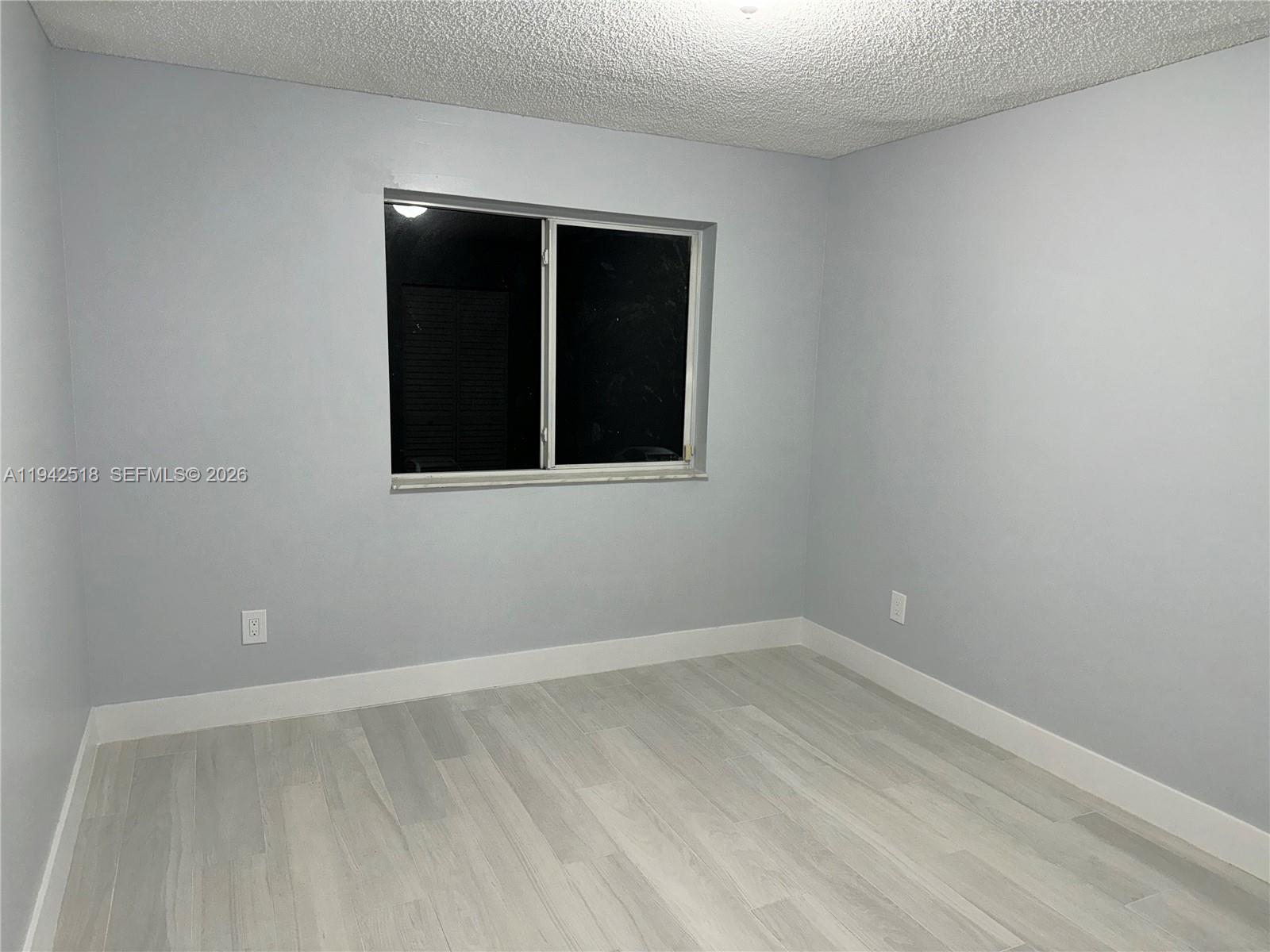440 South Park Road, Unit 4207 Hollywood, FL 33021 - Photo 12 of 14 an empty room with a window