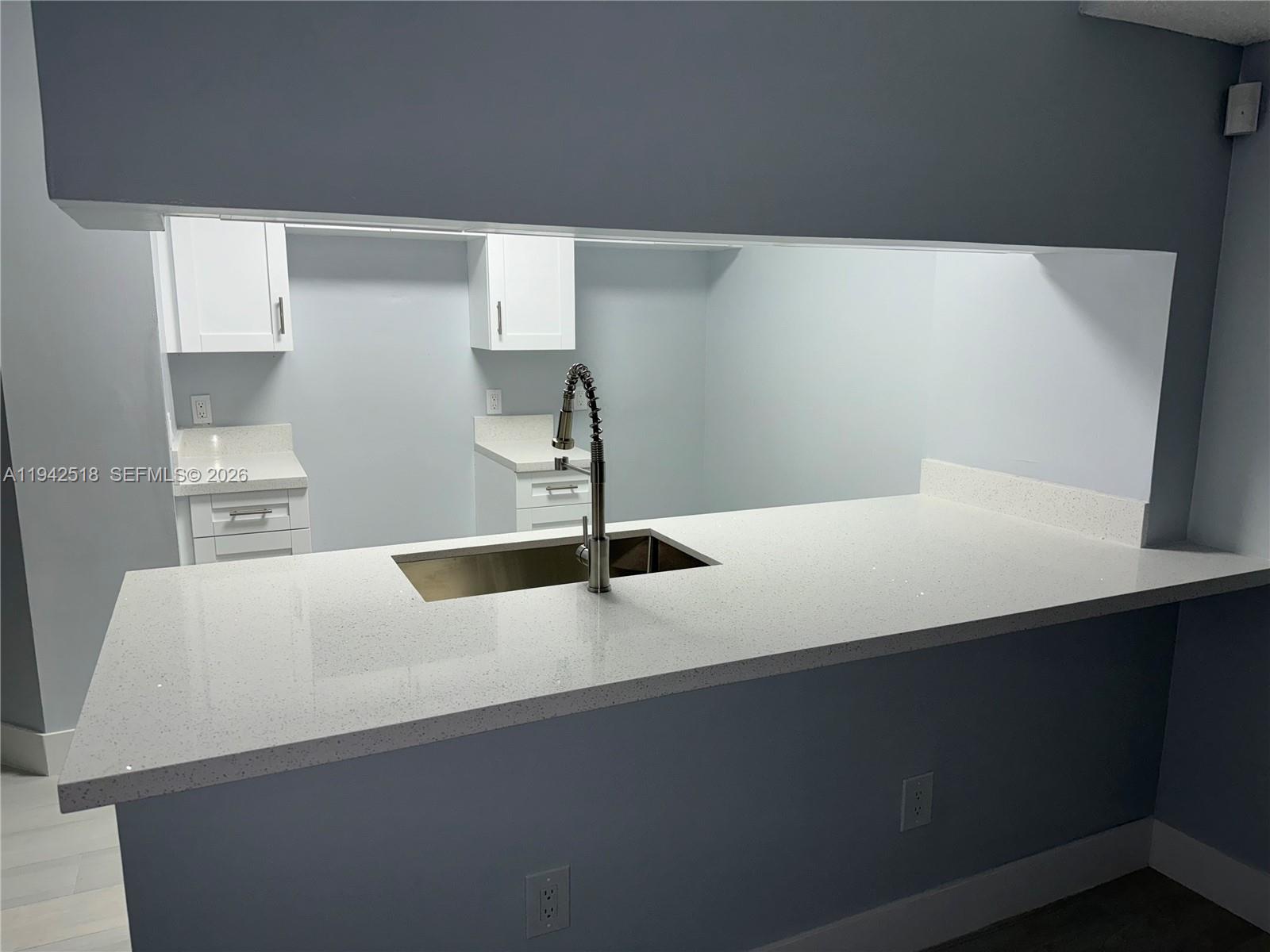 440 South Park Road, Unit 4207 Hollywood, FL 33021 - Photo 6 of 14 a kitchen with a sink and a refrigerator