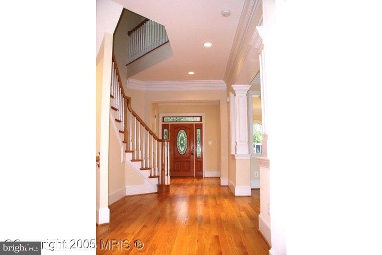 5711 Ridgefield Road Bethesda, MD 20816 - Photo 5 of 6 a view of a hallway with wooden floor