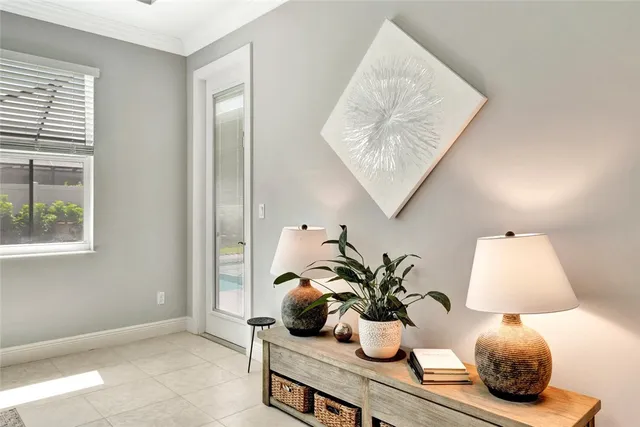 a view of bathroom with a potted plant on the counter and sink