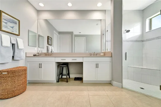 a bathroom with a sink tub and shower