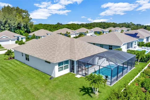 a view of a house with potted plants