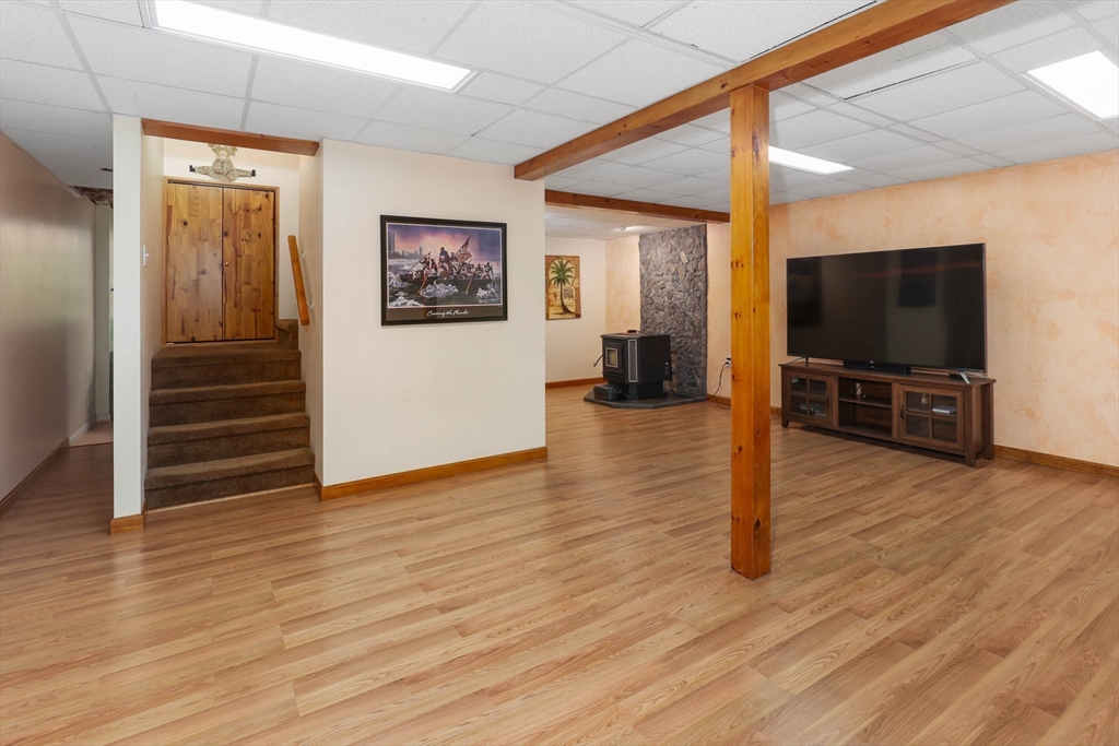73 Allen Road Sturbridge, MA 01566 - Photo 30 of 37 a view of a livingroom with wooden floor and a flat screen tv