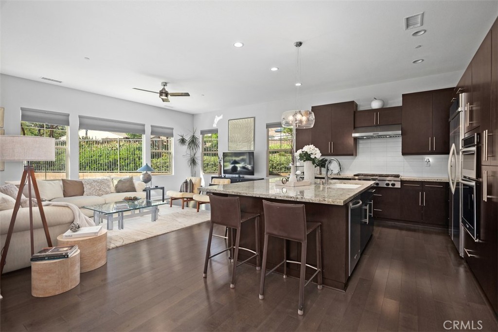 3 Planeo Rancho Mission Viejo, CA 92694 - Photo 11 of 37 a large kitchen with a table and chairs