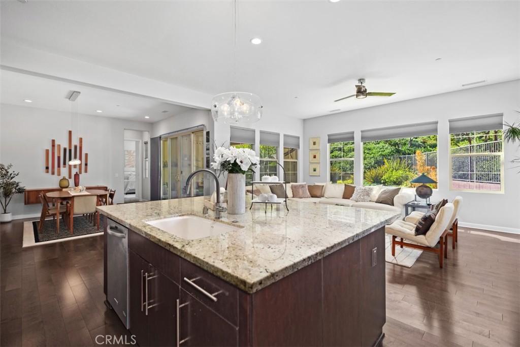 3 Planeo Rancho Mission Viejo, CA 92694 - Photo 12 of 37 a view of kitchen island a dining table wooden floor and a large window