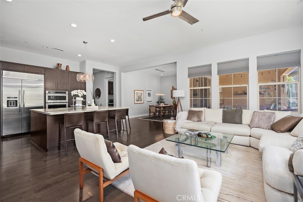 3 Planeo Rancho Mission Viejo, CA 92694 - Photo 15 of 37 a living room with furniture and a view of kitchen