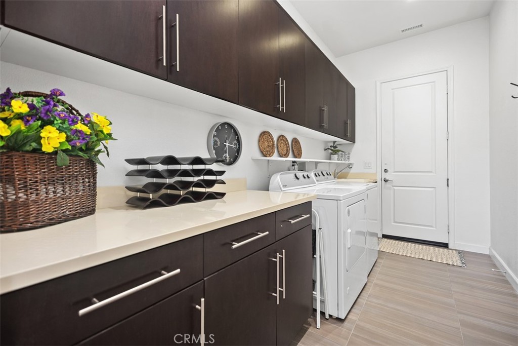 3 Planeo Rancho Mission Viejo, CA 92694 - Photo 18 of 37 a kitchen with a sink a stove and cabinets