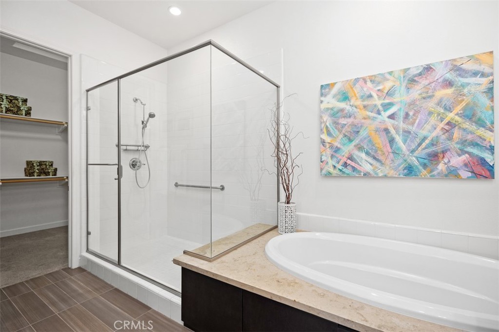 3 Planeo Rancho Mission Viejo, CA 92694 - Photo 21 of 37 a bathroom with a granite countertop sink and a shower
