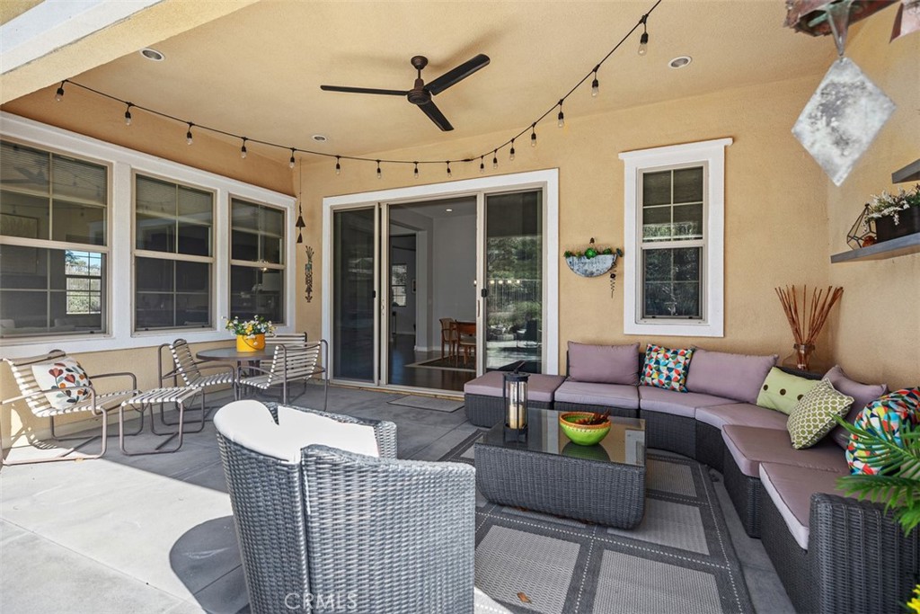 3 Planeo Rancho Mission Viejo, CA 92694 - Photo 24 of 37 a outdoor space with patio the couches and potted plants with the view of the back