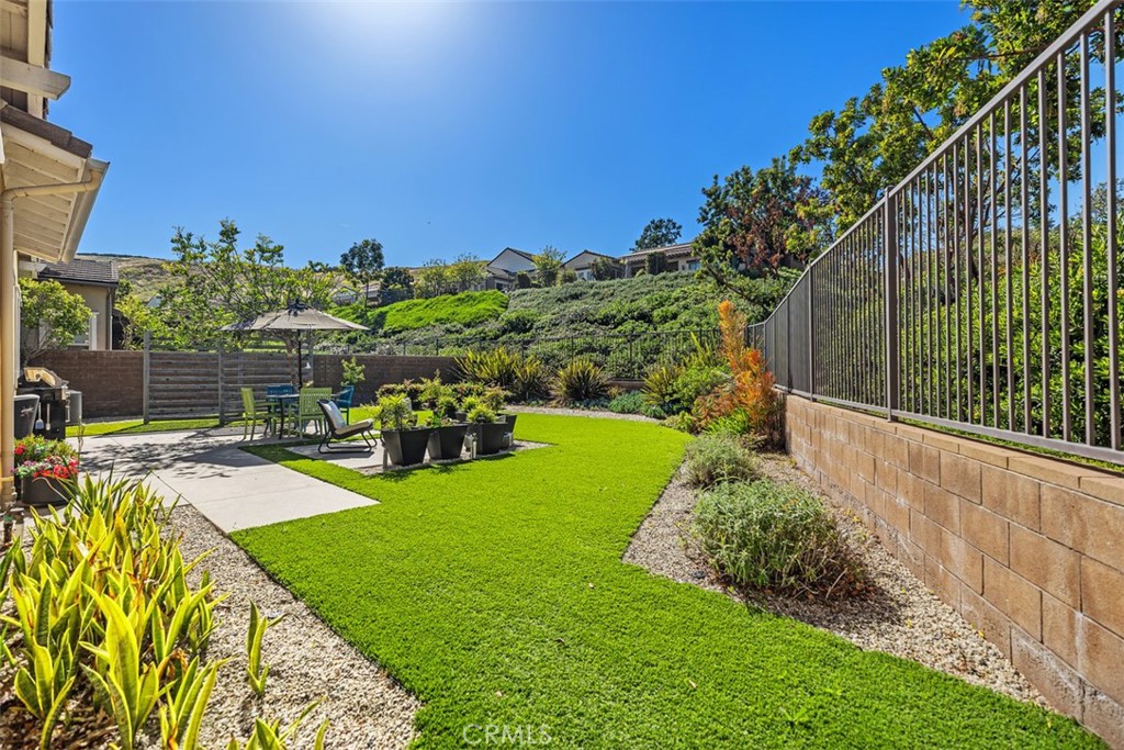 3 Planeo Rancho Mission Viejo, CA 92694 - Photo 27 of 37 a view of a backyard with couches with wooden fence