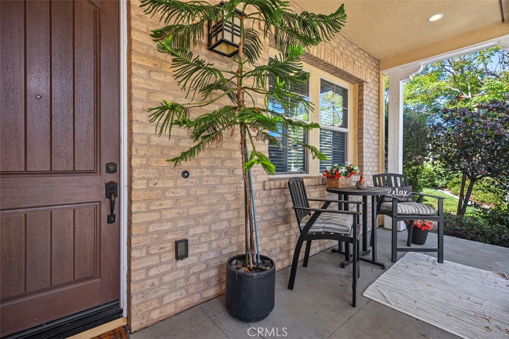 3 Planeo Rancho Mission Viejo, CA 92694 - Photo 31 of 37 a view of a patio with a table and chairs