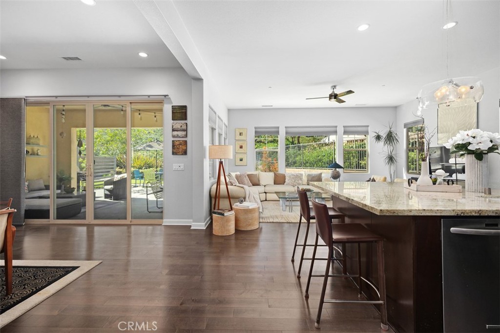 3 Planeo Rancho Mission Viejo, CA 92694 - Photo 4 of 37 a view of dining room and livingroom with furniture wooden floor a chandelier