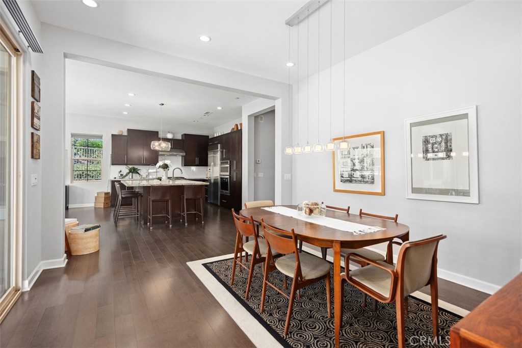 3 Planeo Rancho Mission Viejo, CA 92694 - Photo 7 of 37 a dining hall with stainless steel appliances kitchen island a table and chairs