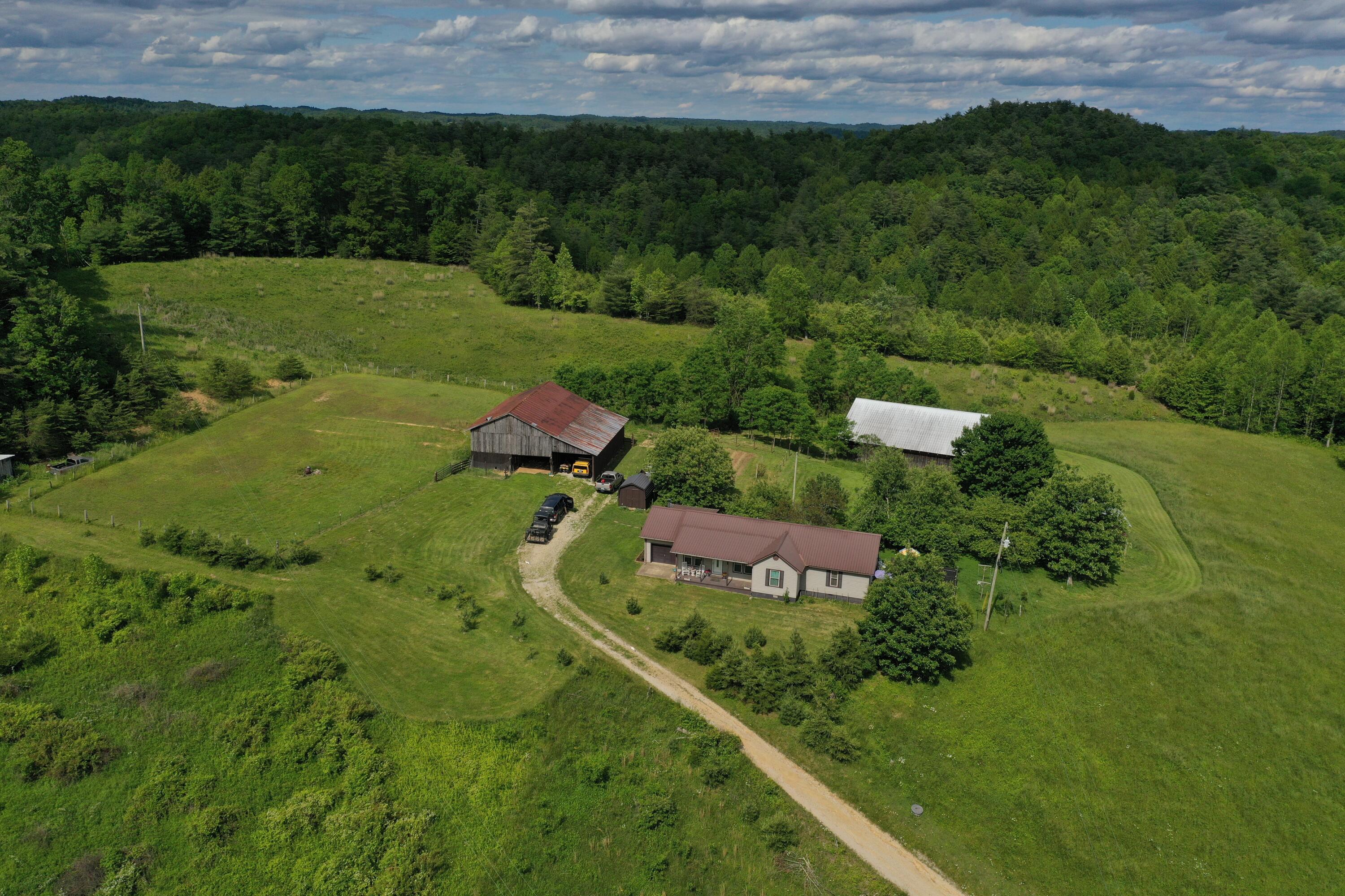 342 Dewey Banks Road Campton, KY 41301 - Photo 1 of 64 001 aerial drone shot of the home and st