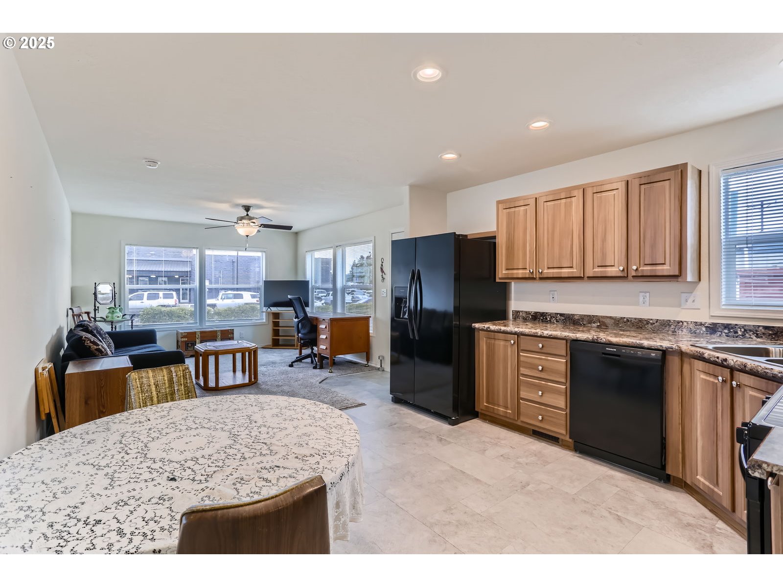 19605 River Road, Unit 3 Gladstone, OR 97027 - Photo 6 of 13 a kitchen with stainless steel appliances granite countertop a refrigerator stove top oven and sink