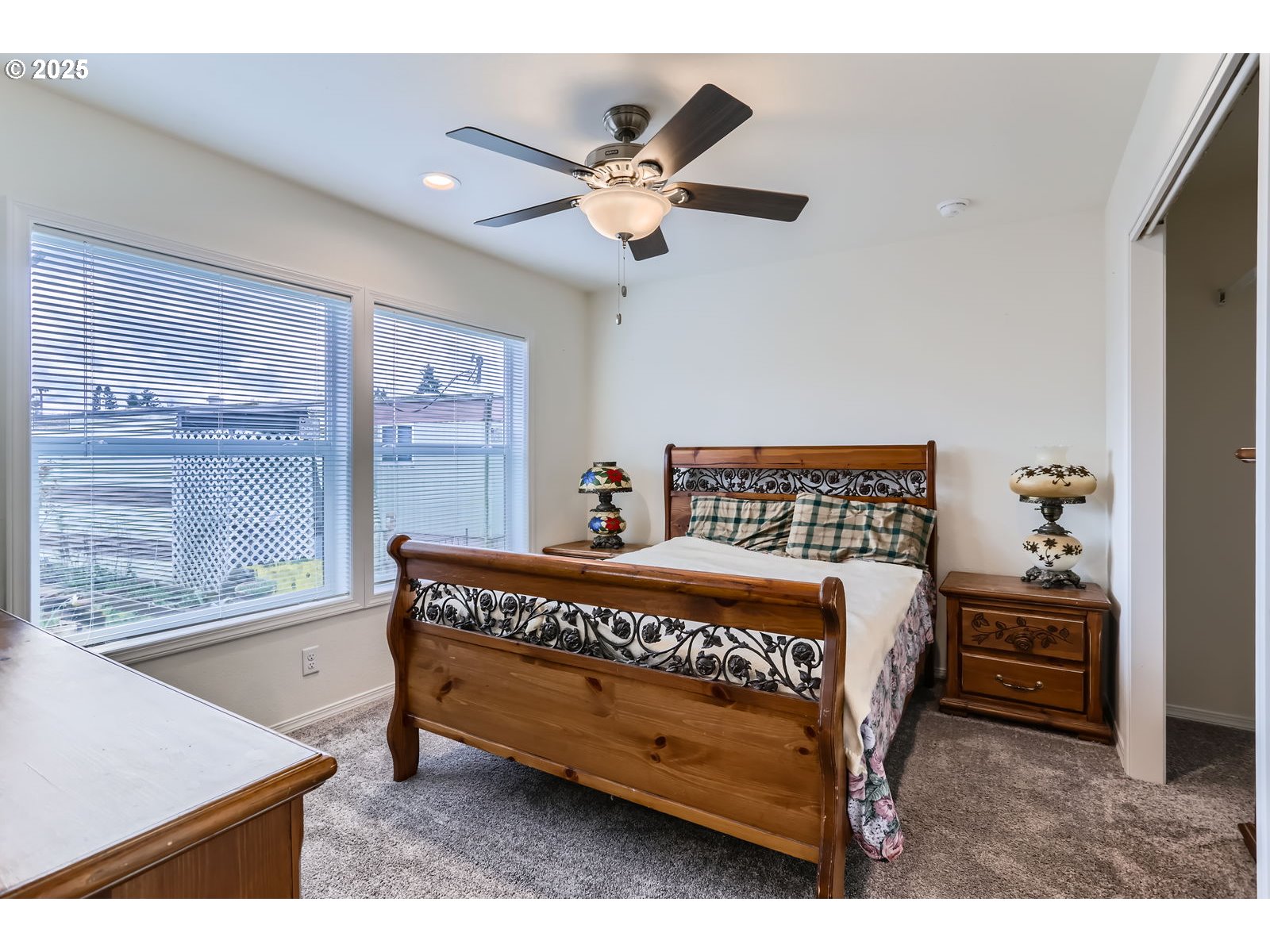 19605 River Road, Unit 3 Gladstone, OR 97027 - Photo 9 of 13 a bed sitting in a bedroom next to a window