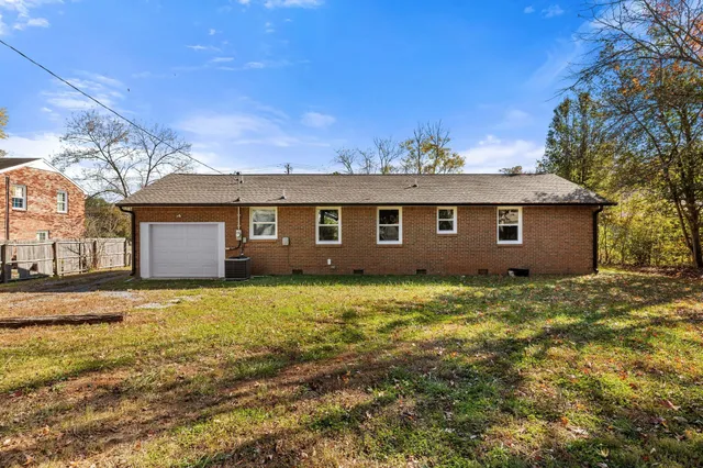 a view of a big yard with a house