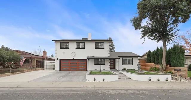 a front view of a house with a garage