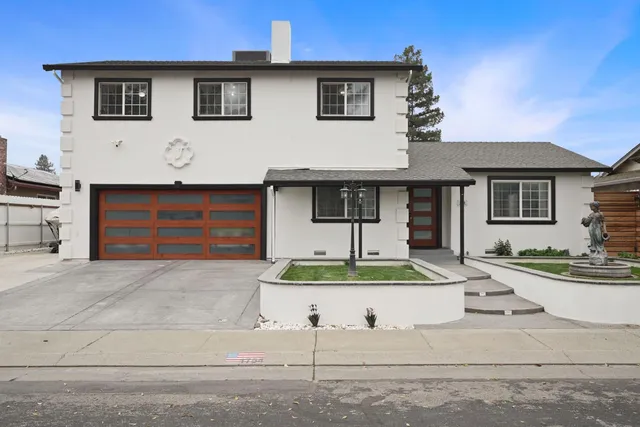 a front view of a house with garage