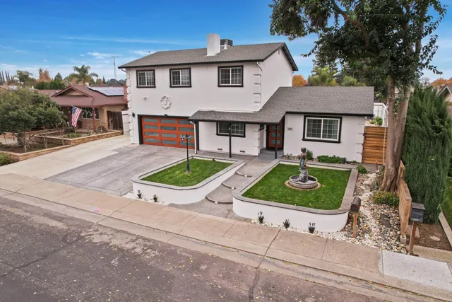 a house view with a garden space