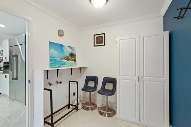 a bedroom with a large bed and a large mirror