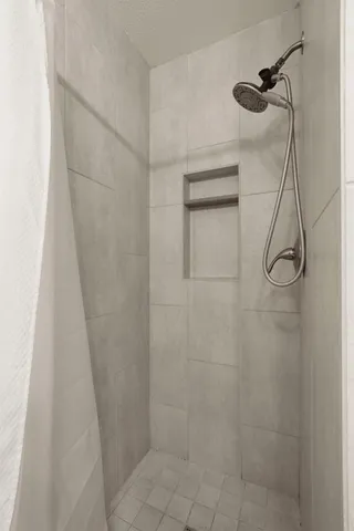 a bathroom with a sink a toilet and a large mirror