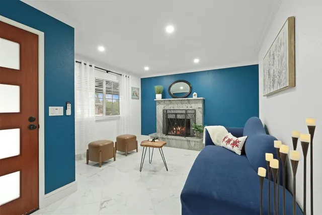 a living room with furniture and a fireplace