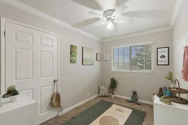 a swimming pool view with a seating space and a garden view