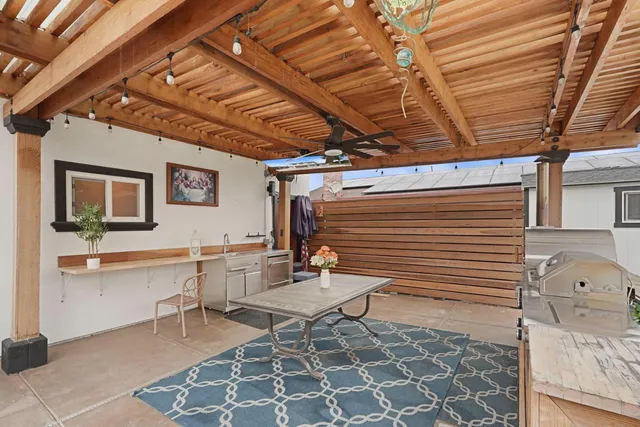 a view of a house with pool and a yard