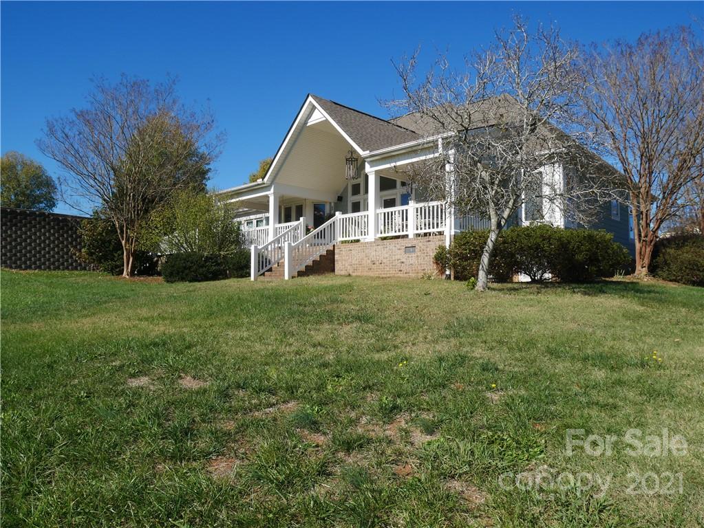 140 Rocky River Road Mooresville, NC 28115 - Photo 3 of 32 a view of a house with a yard