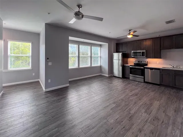 a view of a storage and utility room with two washing machine