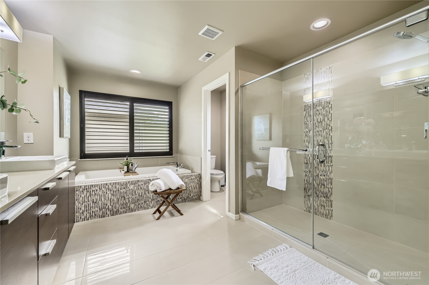 3702 170th Place Southeast Bothell, WA 98012 - Photo 25 of 40 a bathroom with a granite countertop sink toilet and shower