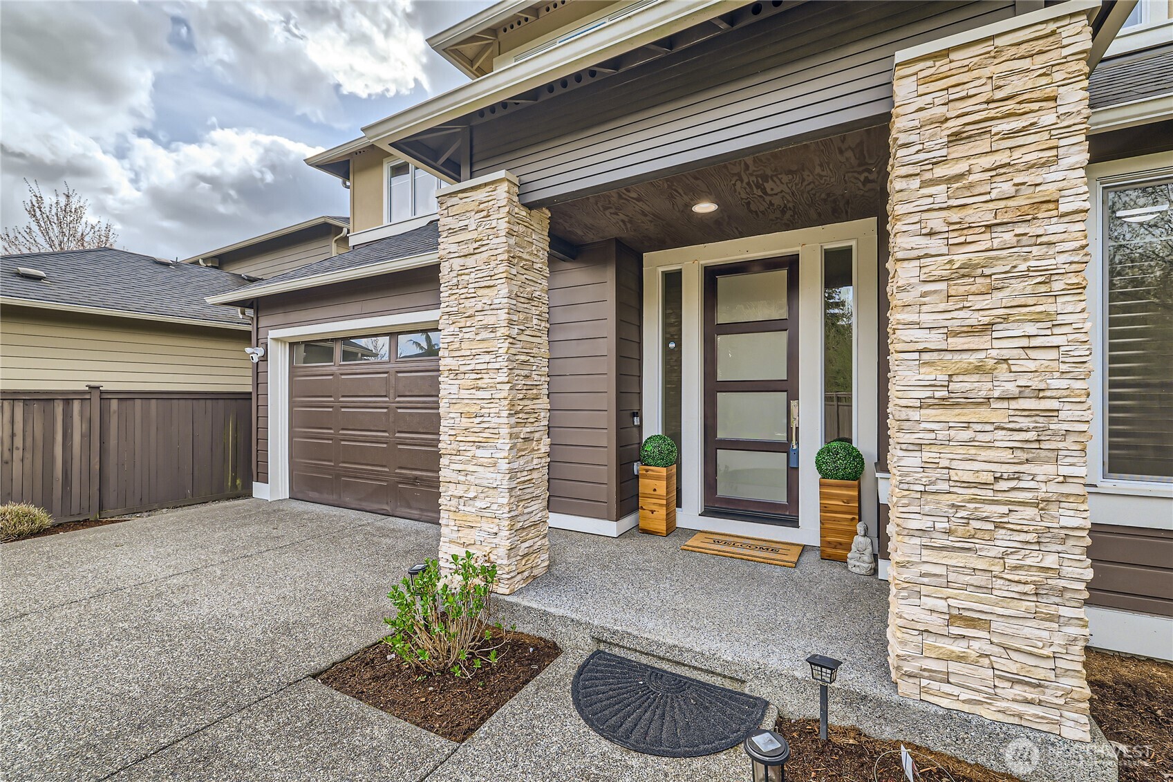 3702 170th Place Southeast Bothell, WA 98012 - Photo 3 of 40 a front view of a house with a yard