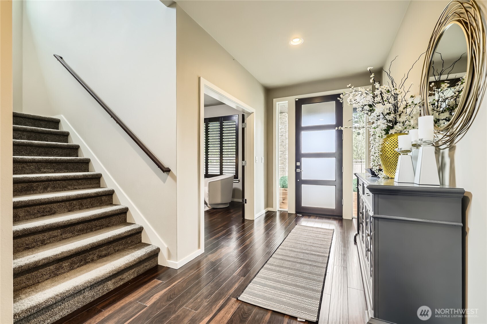 3702 170th Place Southeast Bothell, WA 98012 - Photo 36 of 40 a view of a hallway with wooden floor and staircase