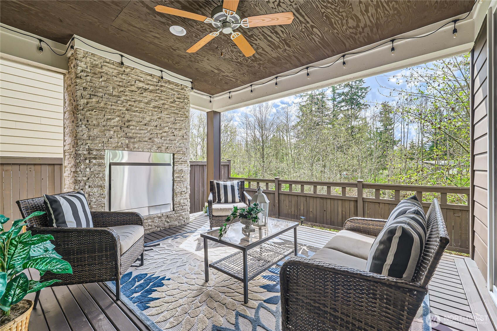3702 170th Place Southeast Bothell, WA 98012 - Photo 39 of 40 a balcony with furniture and a ceiling fan
