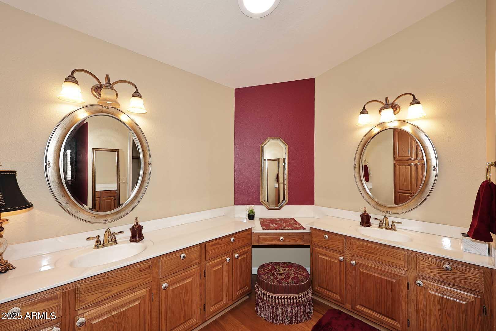 9025 West Marco Polo Road Peoria, AZ 85382 - Photo 25 of 38 a bathroom with a double vanity sink and a mirror