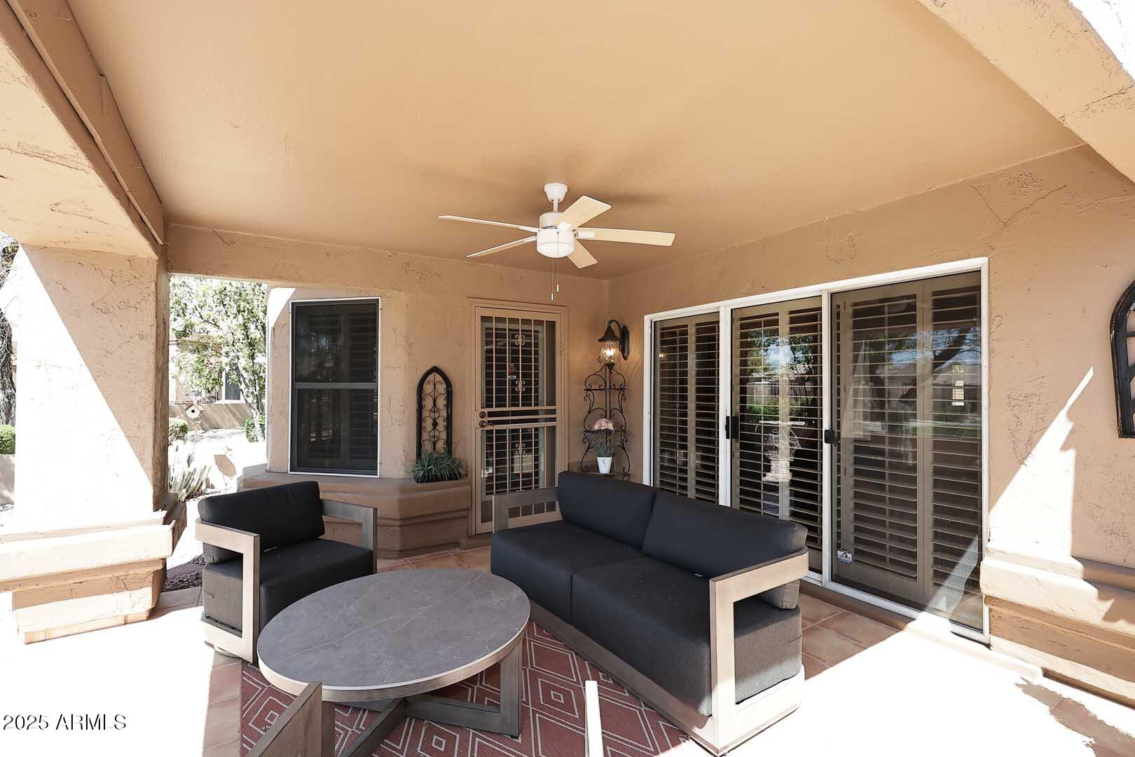 9025 West Marco Polo Road Peoria, AZ 85382 - Photo 28 of 38 a living room with furniture and a large window
