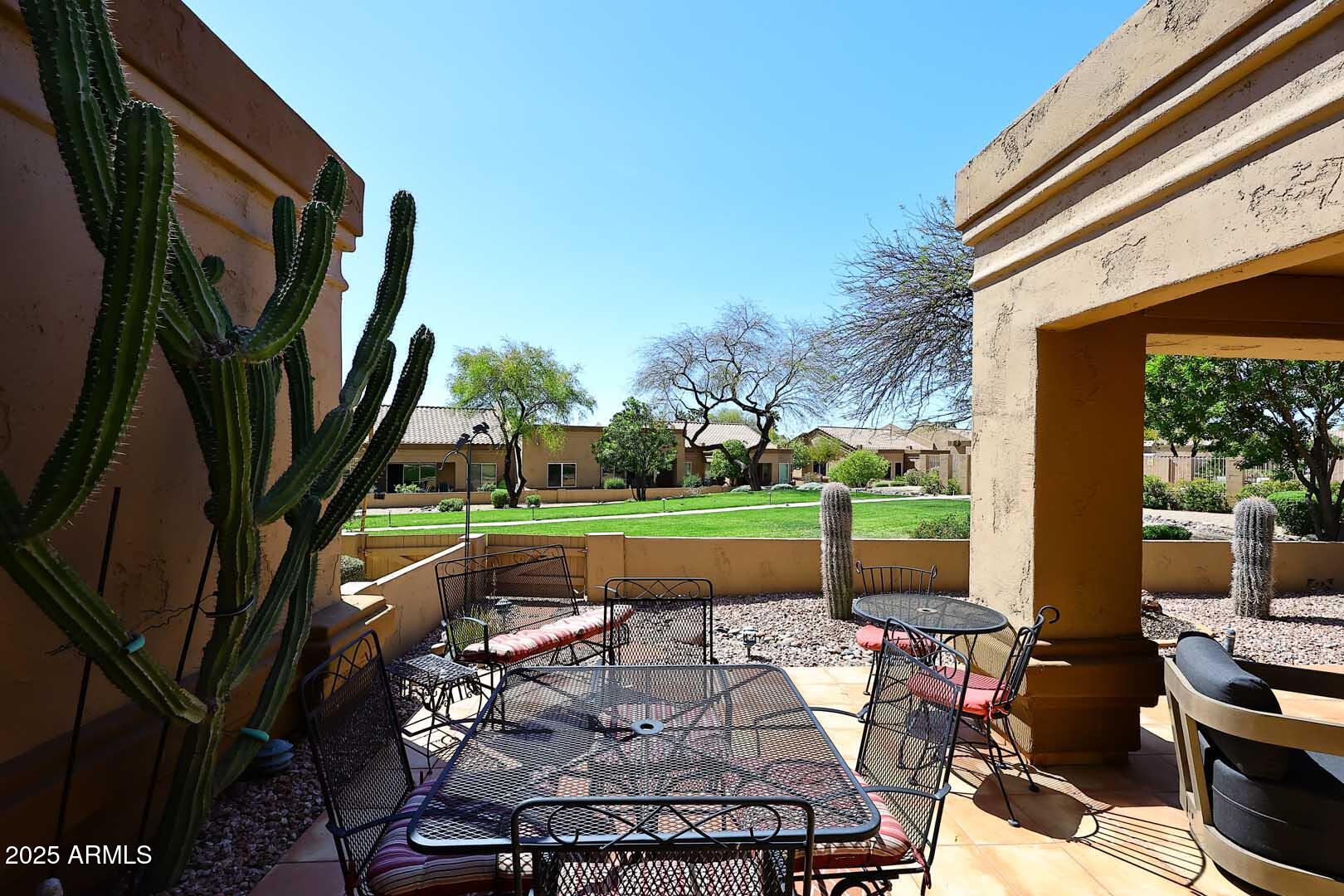 9025 West Marco Polo Road Peoria, AZ 85382 - Photo 31 of 38 a patio with table and chairs