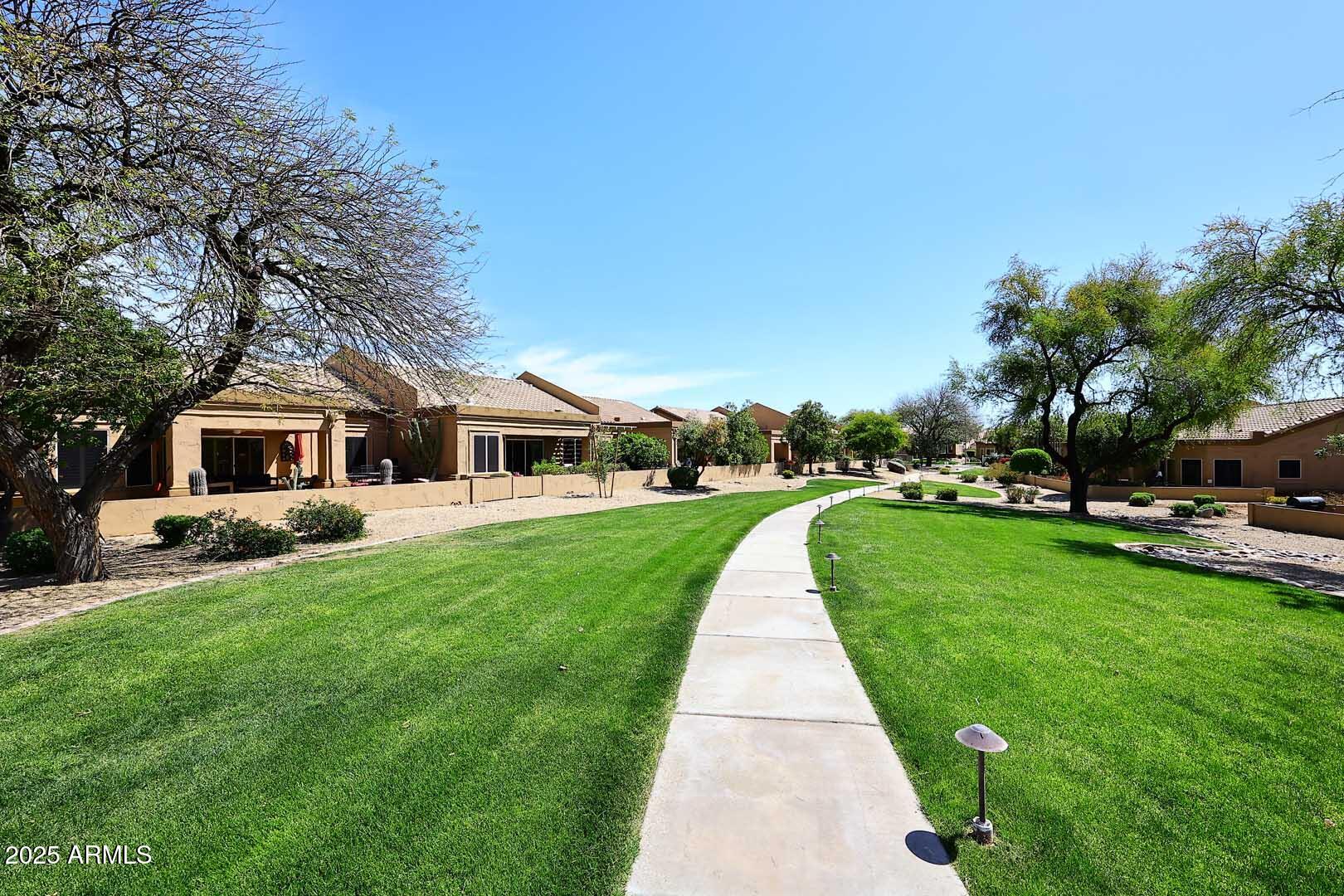 9025 West Marco Polo Road Peoria, AZ 85382 - Photo 35 of 38 a front view of a house with a yard