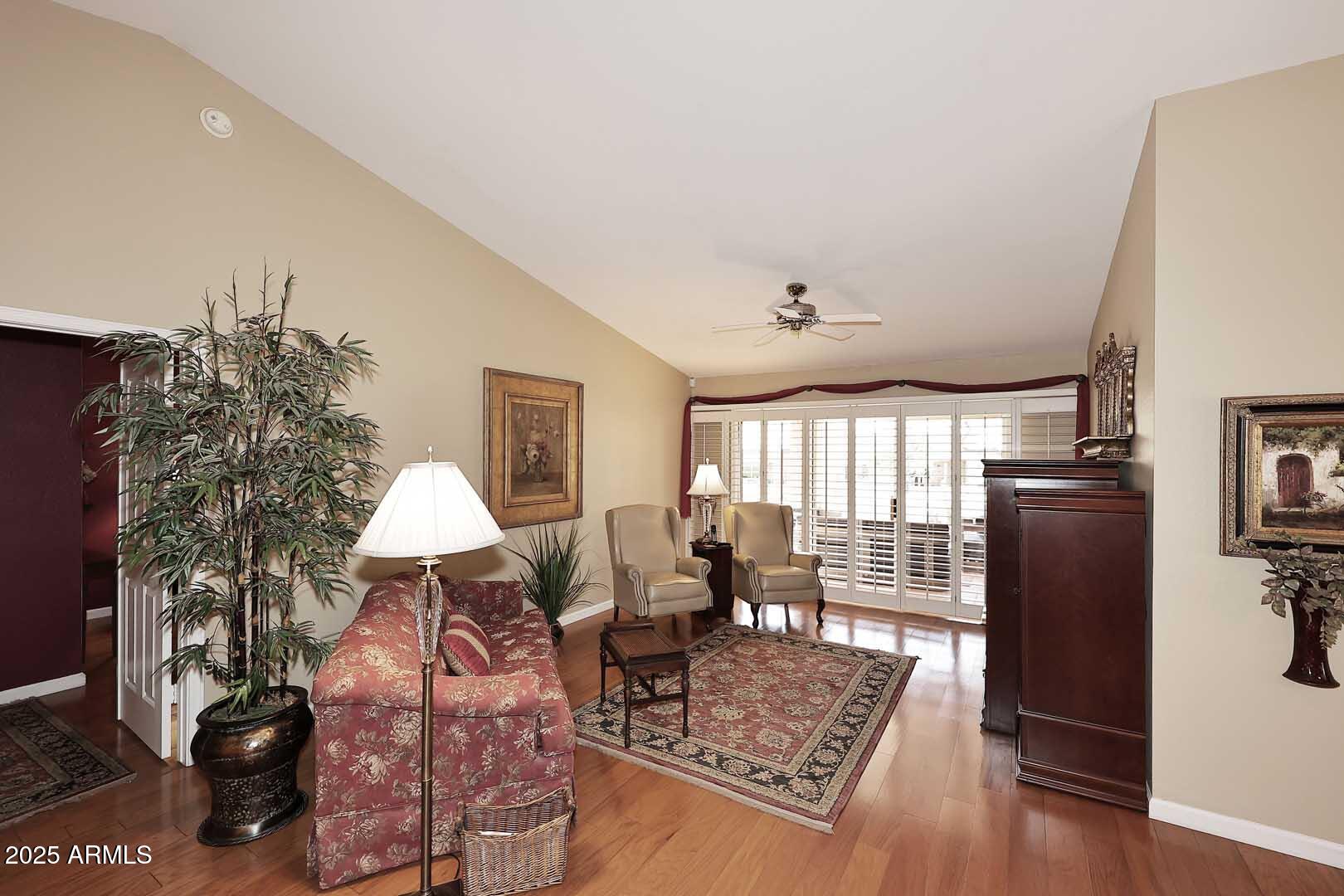 9025 West Marco Polo Road Peoria, AZ 85382 - Photo 6 of 38 a living room with furniture and a window