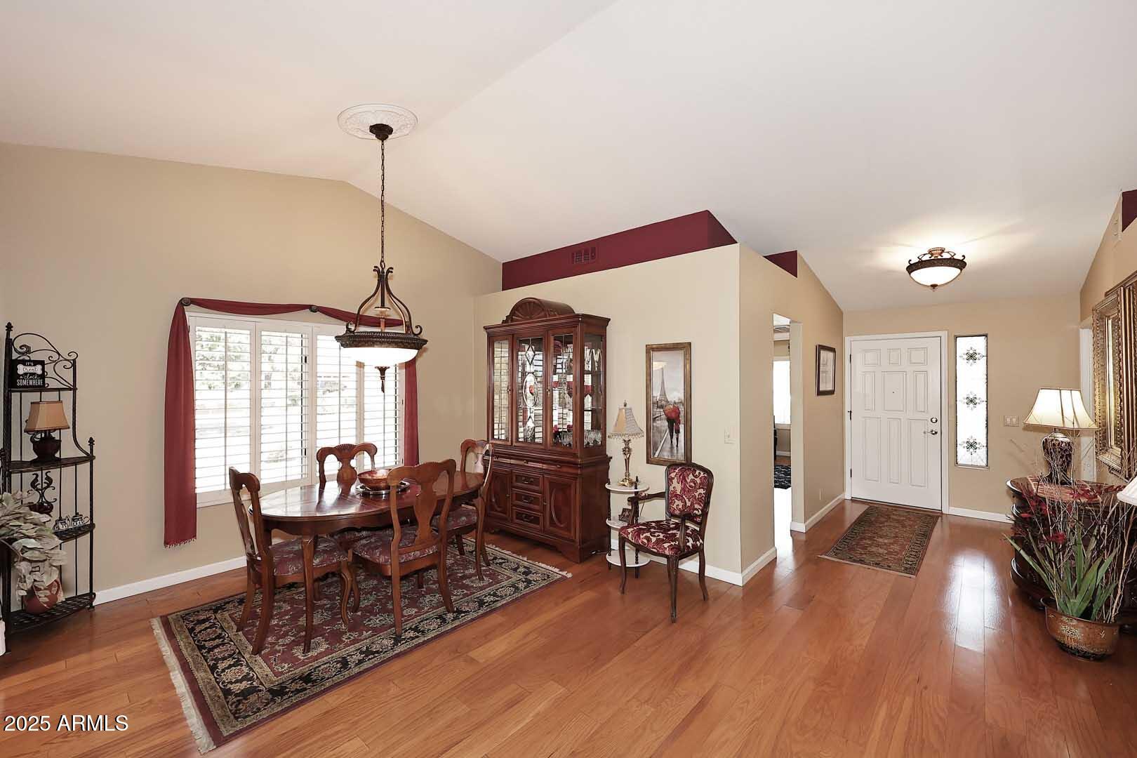 9025 West Marco Polo Road Peoria, AZ 85382 - Photo 10 of 38 a living room with furniture and wooden floor