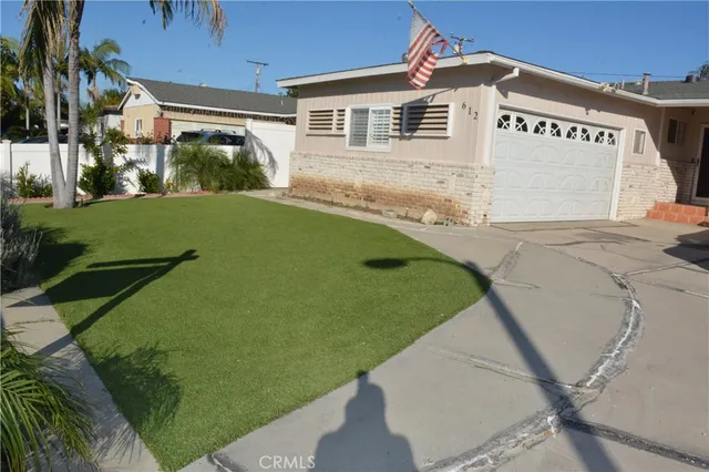 a bathroom with a bathtub and a refrigerator