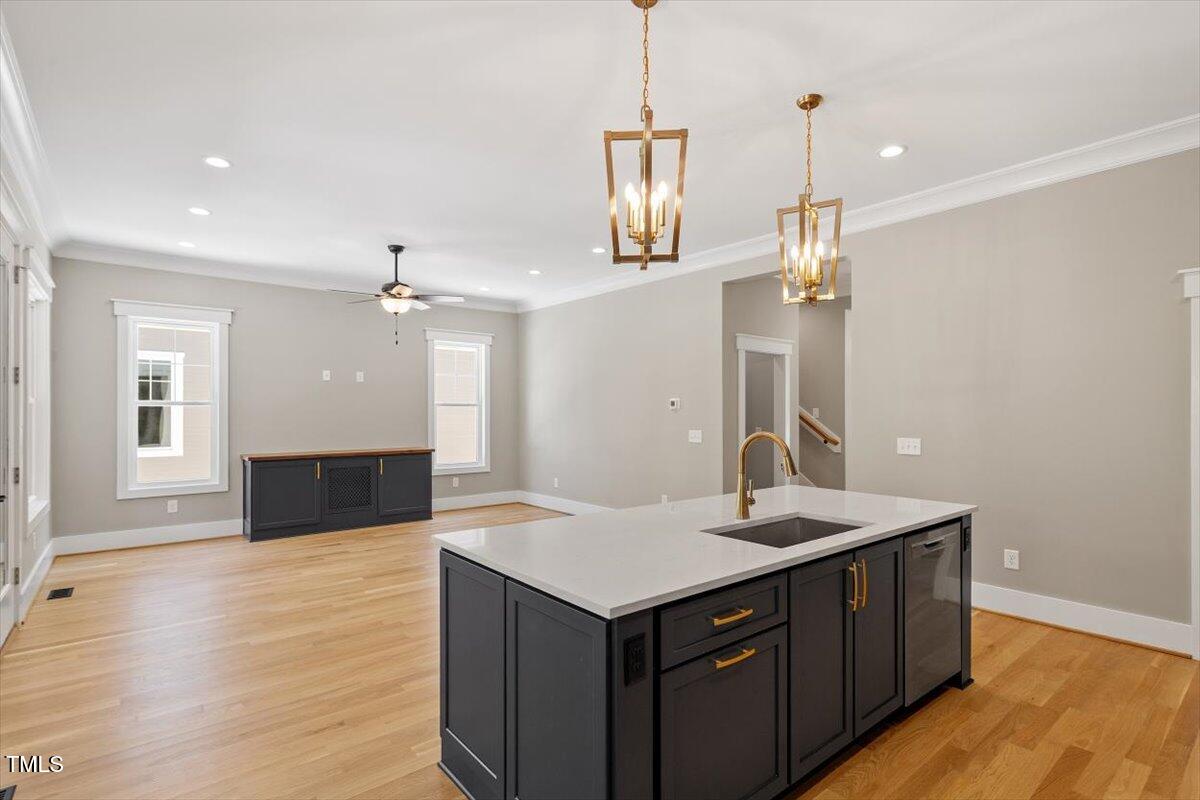 3934 Old Chapel Hill Road Durham, NC 27707 - Photo 21 of 47 a kitchen with a sink a counter space and a window