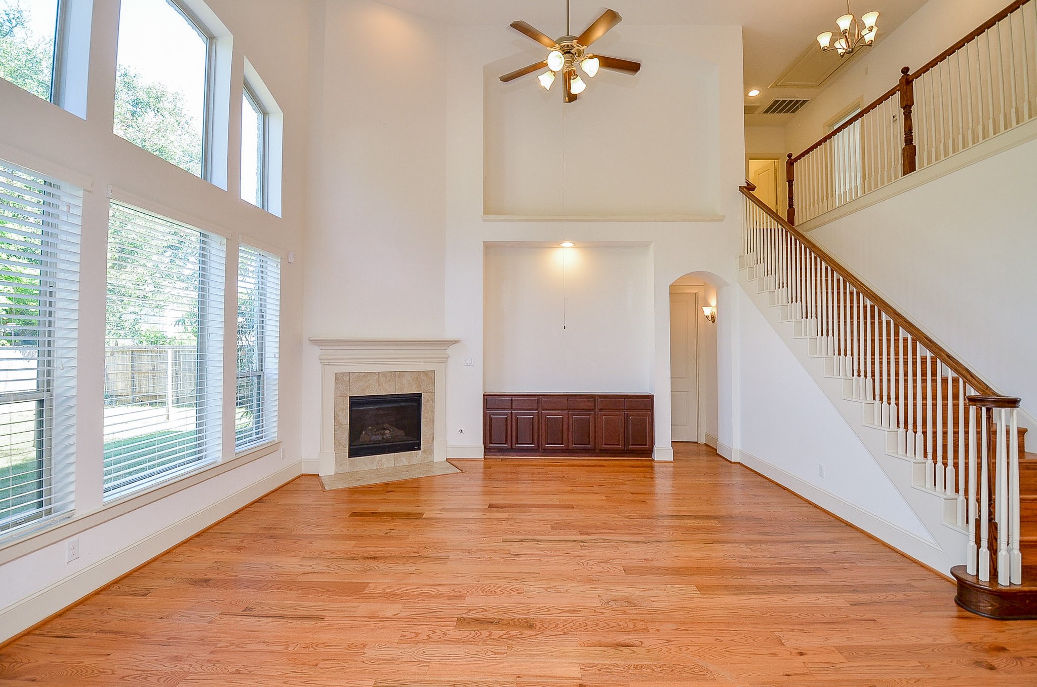 3302 Rochdale Street Houston, TX 77025 - Photo 11 of 49 a view of an empty room with wooden floor and a fireplace