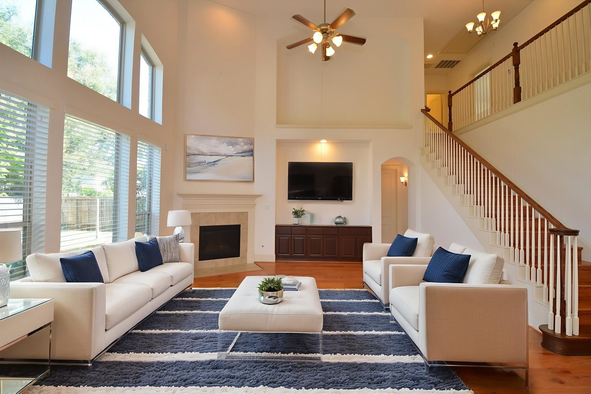 3302 Rochdale Street Houston, TX 77025 - Photo 12 of 49 a living room with furniture a fireplace and a flat screen tv