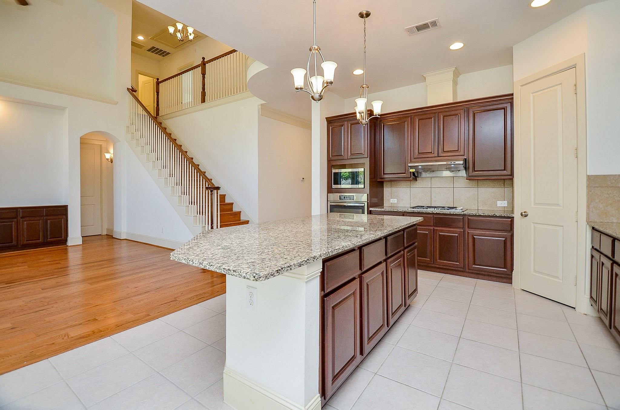 3302 Rochdale Street Houston, TX 77025 - Photo 15 of 49 a kitchen with stainless steel appliances granite countertop a sink counter space cabinets and a large window