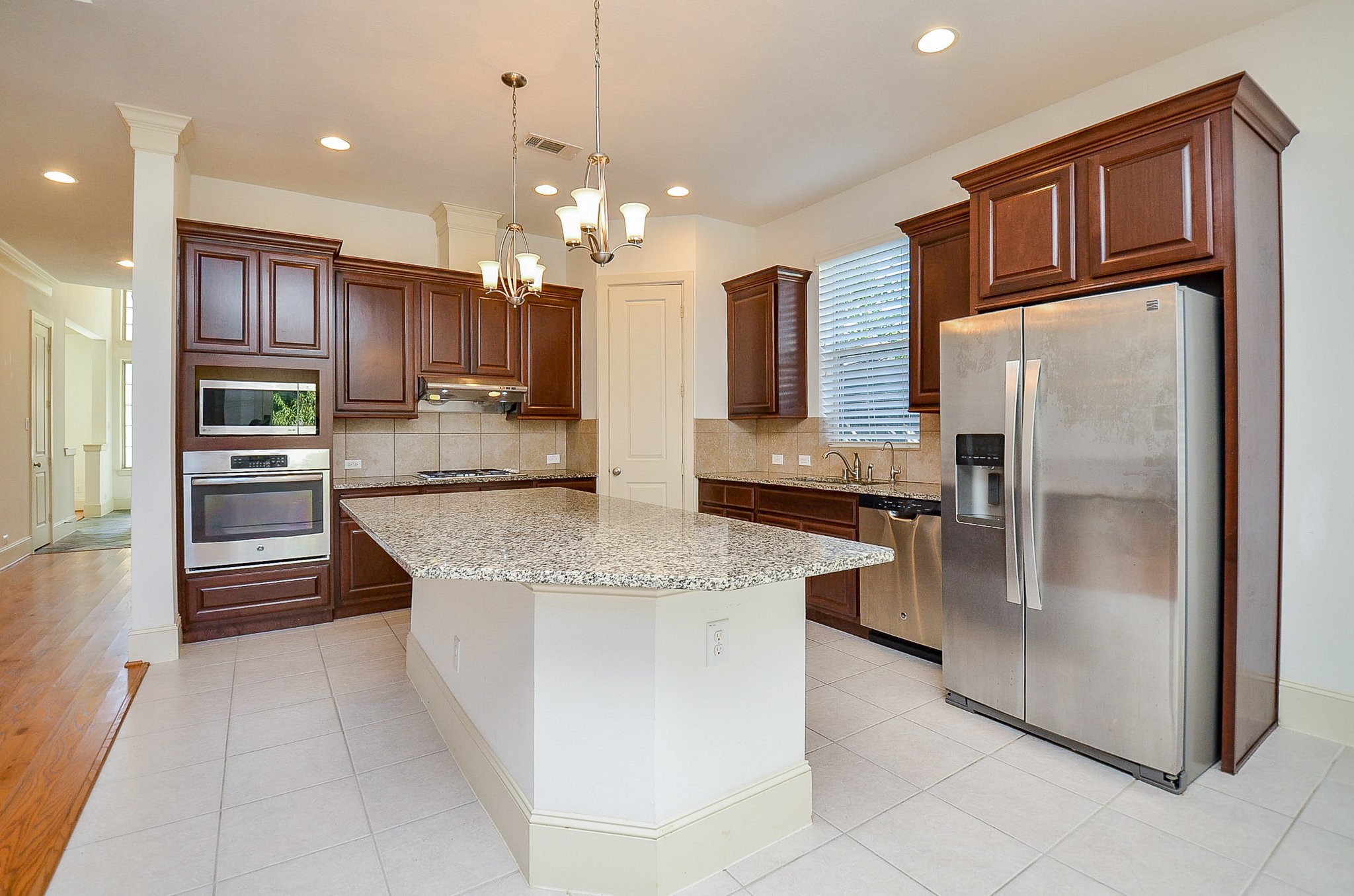 3302 Rochdale Street Houston, TX 77025 - Photo 16 of 49 a kitchen with stainless steel appliances granite countertop a refrigerator a oven and a sink